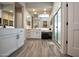 Spacious main bathroom with dual vanities, walk-in shower, and stylish tile flooring at 20210 N Wagner Wash Dr, Buckeye, AZ 85396