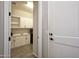Mudroom with white cabinets providing ample storage and seamless transition from outdoors at 20210 N Wagner Wash Dr, Buckeye, AZ 85396