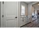 Stylish mudroom featuring white cabinetry and countertop space, conveniently located near the kitchen at 20210 N Wagner Wash Dr, Buckeye, AZ 85396