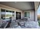 Relax outdoors on this patio with comfortable seating, recessed lighting, and stone flooring at 20210 N Wagner Wash Dr, Buckeye, AZ 85396