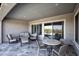 Relax outdoors on the patio with stone flooring and stylish seating with a view of a pool at 20210 N Wagner Wash Dr, Buckeye, AZ 85396