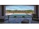 Stunning outdoor pool and living area with a built in outdoor grill at 20210 N Wagner Wash Dr, Buckeye, AZ 85396