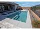 Beautiful backyard pool with a built-in entry steps and a stone tile deck at 20210 N Wagner Wash Dr, Buckeye, AZ 85396