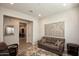 Relaxing sitting area features neutral walls, a patterned rug, and natural light at 20210 N Wagner Wash Dr, Buckeye, AZ 85396