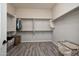 Spacious walk-in closet with ample shelving and storage, and neutral color scheme at 20210 N Wagner Wash Dr, Buckeye, AZ 85396