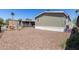 Gravel backyard featuring a patio, showing a compact outdoor living space with potential for personalization at 2060 N Center St # 138, Mesa, AZ 85201