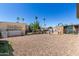 Wide gravel backyard showing an open area with potential for landscaping and outdoor activities at 2060 N Center St # 138, Mesa, AZ 85201