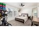 Cozy bedroom with a ceiling fan, carpeted floor, and lots of natural light from the window at 2060 N Center St # 138, Mesa, AZ 85201