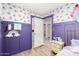 Stylish bedroom with wainscoting and a glimpse into the hallway, showcasing the home's layout at 2060 N Center St # 138, Mesa, AZ 85201