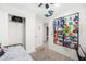 Efficiently organized bedroom with storage and display for toys, maximizing space at 2060 N Center St # 138, Mesa, AZ 85201