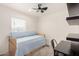Cozy bedroom featuring a trundle bed and built in shelving, perfect for guests or children at 2060 N Center St # 138, Mesa, AZ 85201
