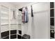 Open closet featuring shelves and racks for clothing and accessories at 2060 N Center St # 138, Mesa, AZ 85201