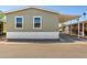 Charming single-story home with a covered carport and low-maintenance landscaping at 2060 N Center St # 138, Mesa, AZ 85201