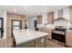Modern kitchen with an island, stainless steel appliances, and ample cabinet space at 2060 N Center St # 138, Mesa, AZ 85201