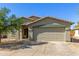 Charming single-story home featuring a two-car garage, desert landscaping, and a welcoming front entrance at 2122 W Alta Vista Rd, Phoenix, AZ 85041