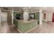 This kitchen features stainless steel appliances, an island with bar seating, and ample cabinet storage space at 2122 W Alta Vista Rd, Phoenix, AZ 85041