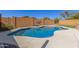 Backyard swimming pool with a custom deck and mature landscaping at 2122 W Alta Vista Rd, Phoenix, AZ 85041