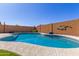 View of the pool and patio area with decorative backyard wall at 2122 W Alta Vista Rd, Phoenix, AZ 85041