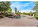 Spacious backyard with a pool, rock features, and ample patio space at 21373 N 94Th Ave, Peoria, AZ 85382