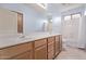 Bathroom features a dual sink vanity, a shower with a curtain, and a toilet at 21373 N 94Th Ave, Peoria, AZ 85382