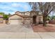 Inviting two-story home with a three-car garage and well-maintained front yard at 21373 N 94Th Ave, Peoria, AZ 85382