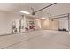Ample garage space features storage cabinets and room for several vehicles at 21373 N 94Th Ave, Peoria, AZ 85382