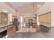 An expansive kitchen with modern appliances, tile flooring, and plenty of counter space at 21373 N 94Th Ave, Peoria, AZ 85382