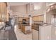 Open kitchen featuring an island, granite countertops, stainless appliances, and tile flooring at 21373 N 94Th Ave, Peoria, AZ 85382