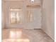 Inviting foyer area with plenty of natural light and tile accents at 21373 N 94Th Ave, Peoria, AZ 85382