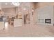 Open living area with high ceilings, fireplace, and staircase access at 21373 N 94Th Ave, Peoria, AZ 85382