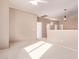 Bright and airy living room with high ceilings, neutral colors, and carpeted floors at 21373 N 94Th Ave, Peoria, AZ 85382