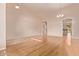 Spacious living room with hardwood floors and neutral colored walls at 21373 N 94Th Ave, Peoria, AZ 85382