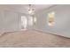 Bright main bedroom with large windows, ceiling fan, and neutral-toned walls and flooring at 21373 N 94Th Ave, Peoria, AZ 85382
