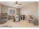Spacious bedroom filled with books, toys, and a large beanbag chair at 21918 E Maya Rd, Queen Creek, AZ 85142