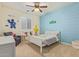 Themed bedroom shows blue accent wall, ceiling fan and a twin bed at 21918 E Maya Rd, Queen Creek, AZ 85142