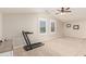 Bright bonus room with a treadmill, perfect for exercise or recreation at 21918 E Maya Rd, Queen Creek, AZ 85142