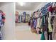 Walk in closet complete with extensive shelving and hanging storage at 21918 E Maya Rd, Queen Creek, AZ 85142