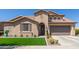 Inviting exterior with desert landscaping, artificial lawn, and a covered entry at 21918 E Maya Rd, Queen Creek, AZ 85142