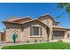 Lovely home with a well-maintained front yard and desert-inspired accents at 21918 E Maya Rd, Queen Creek, AZ 85142