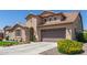 Well-maintained home with charming desert landscaping and a spacious driveway at 21918 E Maya Rd, Queen Creek, AZ 85142