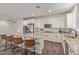 Well-lit kitchen with a sizable island featuring barstool seating, stainless appliances, and ample counter space at 21918 E Maya Rd, Queen Creek, AZ 85142