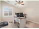 Bright office featuring a large desk setup and comfortable lighting at 21918 E Maya Rd, Queen Creek, AZ 85142
