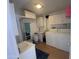 Bathroom featuring a sink, vanity, walk-in shower, storage cabinet, washing machine, and dryer at 2192 W Taos Ave, Apache Junction, AZ 85119