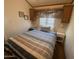 Comfortable bedroom featuring a cozy bed with decorative pillows and bedside lamps, creating a peaceful retreat at 2192 W Taos Ave, Apache Junction, AZ 85119