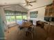 Cozy dining area with a wood table, chairs, and a window offering natural light, creating a welcoming space at 2192 W Taos Ave, Apache Junction, AZ 85119