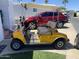 Parked golf cart and car in community at 2192 W Taos Ave, Apache Junction, AZ 85119