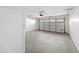 Attached garage featuring a refrigerator and garage door at 2206 S 114Th Ln, Avondale, AZ 85323