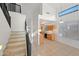 Bright interior featuring a staircase, kitchen, light fixtures and an open floor plan at 2206 S 114Th Ln, Avondale, AZ 85323