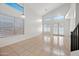 Spacious living area with tile flooring, high ceilings, and large windows, perfect for modern living at 2206 S 114Th Ln, Avondale, AZ 85323