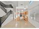 Bright open-concept living room with sleek staircase, soaring ceilings, tile floors, and modern finishes at 2206 S 114Th Ln, Avondale, AZ 85323